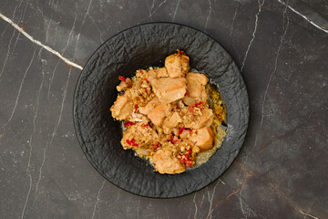 Top view of portion of chicken fillet ragout with walnuts