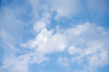 Sky background with clouds. White clouds against a blue sky.