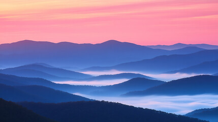 Fototapeta premium Breathtaking Sunrise Over Mountain Range with Pink and Orange Sky, Mist Gently Covering Valleys Below, Capturing the Serenity of Nature