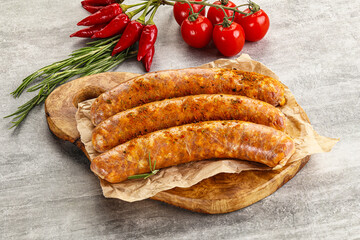 Raw sausages with spices and herbs