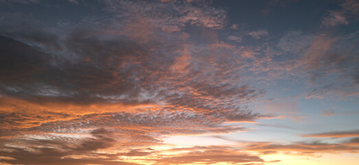 Sunset Clouds background. Dramatic Clouds Sunset Background. Sky with clouds in Sunrise. Sunrise with clouds in various shapes background. Calm Cloud.