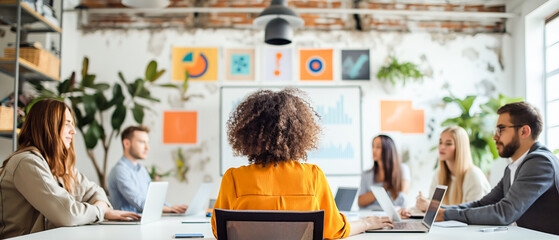 A team meeting in a modern office, with one person facing the camera, creative workspace background, concept of teamwork and collaboration. Generative AI