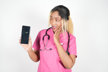 Female doctor conducting online consultations with patients via video call from her cell phone.The...