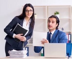 Two employees working in the office