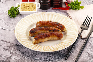 Delicous natural roasted sausages in the plate