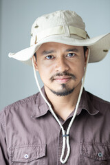 Samart executive camping man with advaenture hat on white background