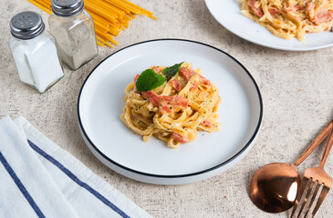homemade fettuccine pasta with white cream sauce. fettuccine Carbonara, Italian food. Perfect for recipes, articles or any cooking content.