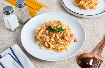 homemade fettuccine pasta with white cream sauce. fettuccine Carbonara, Italian food. Perfect for recipes, articles or any cooking content.