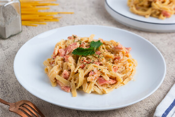 homemade fettuccine pasta with white cream sauce. fettuccine Carbonara, Italian food. Perfect for recipes, articles or any cooking content.