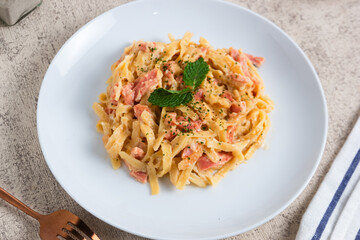 homemade fettuccine pasta with white cream sauce. fettuccine Carbonara, Italian food. Perfect for recipes, articles or any cooking content.