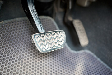 Hybrid electric car interior element, metal gas accelerate and brake pedal. Sport car with...