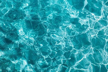 Obraz premium Calm turquoise water with gentle ripples and reflections, evoking a serene and refreshing atmosphere. 