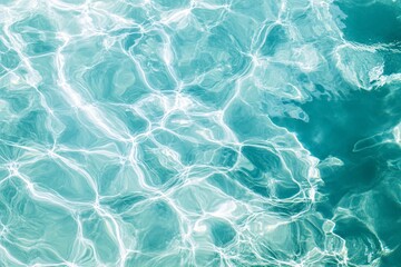 Obraz premium Calm turquoise water with gentle ripples and reflections, evoking a serene and refreshing atmosphere. 