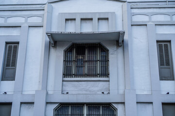 front view of a classic old building with lots of windows.