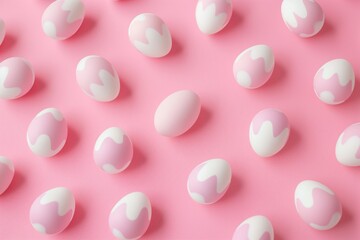 Pink Easter eggs pattern on pink background. Multiple eggs in various sizes, scattered randomly. Simple, pastel color scheme. No people or objects nearby.