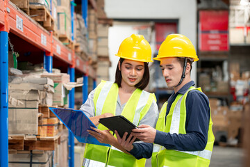 Warehouse worker checking packages on shelf in a large store