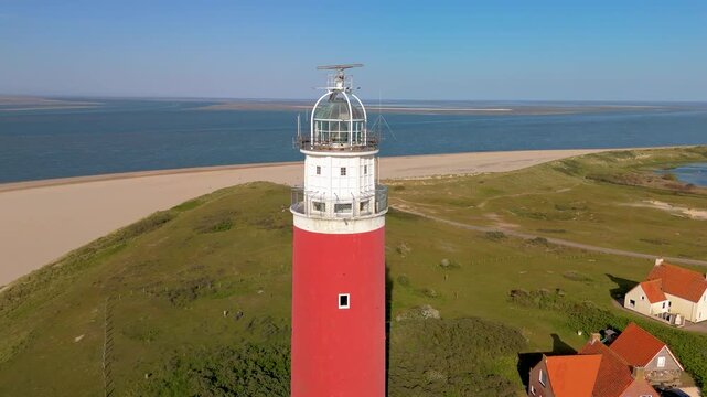 Visit the iconic Texel lighthouse, a beautiful island in the Netherlands, where you can relax on pristine beaches and enjoy breathtaking coastal views that captivate every visitor