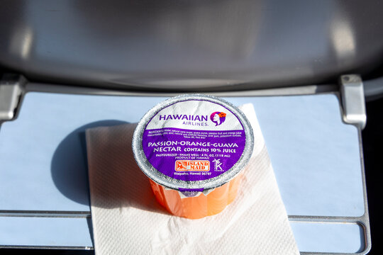 Hawaiian Airlines POG Passion-Orange-Guava on a Boeing 717 Tray Table