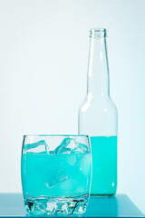 Blue drink on a light background. Refreshing cocktail