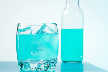 Blue drink on a light background. Refreshing cocktail