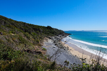 Noosa National Park, Coastal Walk, hike along the stunning blue sea and ocean on a beautiful sunny blue sky day, Sunshine Coast, Australia 