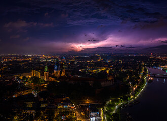 Thunderstorm over the Wawel Royal Castle in Krakow. Panorama of the city of Krakow. Night. Poland, Europe. Aerial photos from a drone.