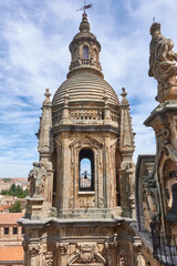 Sinister sculpture of a bishop in the bell tower of the Real Clerecía de San Marcos in Salamanca, Castilla y Leon, Spain