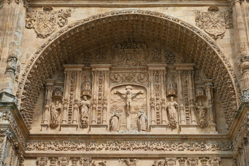 Ornate pediment or barrel vault of the façade of the church of San Esteban in Salamanca, Castilla y Leon, Spain