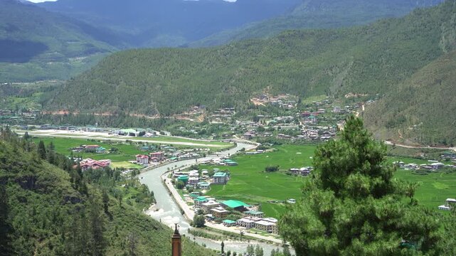Bhutan, Paro city with Paro River flows through, viewed from high surrounded by mountains Himalayas. Bhutan officially Kingdom of Bhutan, Landlocked country in South Asia situated in Eastern Himalayas