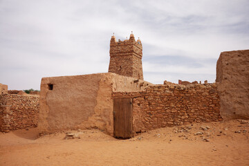 The mosque of Chinguetti with its stone minaret in the Adrar region (Mauritania). Chinguetti is considered to be the seventh city of Islam.