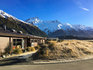 Hiking in a beautiful sunny blue sky winter day at Mount Cook national park,  South Island New...