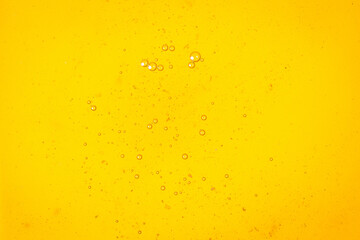 Yellow sweet honey with air bubbles pattern background.