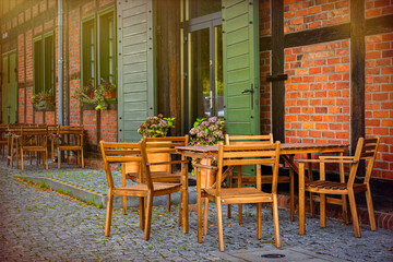 Fall sidewalk cafe. Autumn cityscape