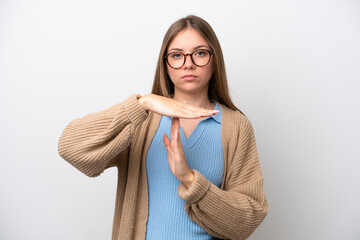 Young Lithuanian woman isolated on white background making time out gesture
