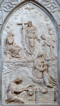 MILAN, ITALY - MARCH 6, 2024: The relief of Jesus wtih saint on the tomb stone of Adalberto Giuseppe e Francesca Barbo in church Chiesa di Santa Maira del Carmine by Gaetano Monti (1776 &ndash; 1847).