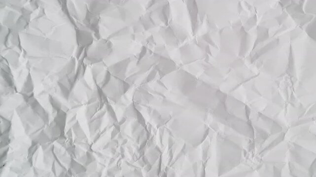 A full screen paper burst with a hole tearing from the middle in a stop motion style.