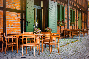 Fall sidewalk cafe. Autumn cityscape