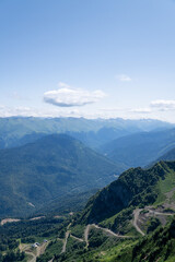 View of rocky mountains and forest on a sunny summer day