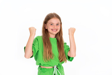 Charming young girl winner isolated on white background in green outfit