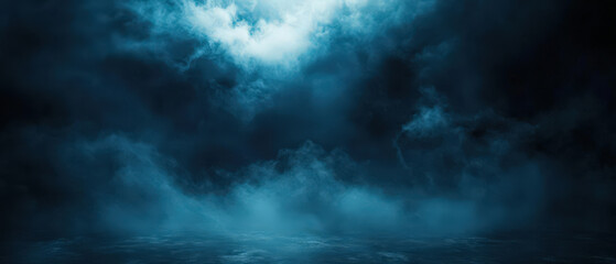 Fototapeta premium A dark blue sky with clouds and a foggy mist
