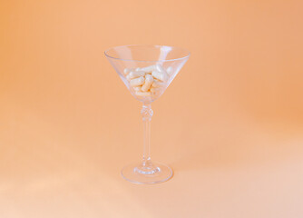 pills in a martini glass, medicine concept