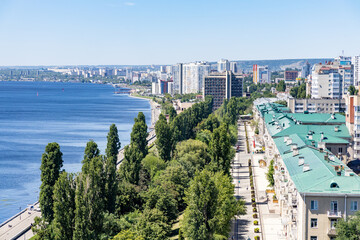 View of the city and the Volga River embankment from a height. A sunny summer day. The city of Saratov, Russia