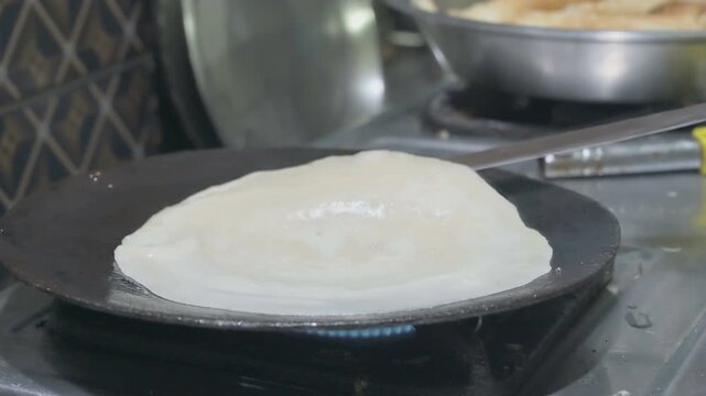 Patishapta Pitha, a famous Bengali Dessert Recipe, being prepared during Winter season. Patishapta is a type of pithe made in celebratory occasions, quick Indian dessert. Howrah, West Bengal, India