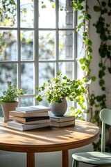 Round Wooden Table with Books, Plants, and Green Chair in Bright Dining Room