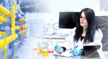 Industrial laboratory assistant. Woman analyzes manufactured products. Inspector checks quality of substances. Laboratory assistant at industrial enterprise. Woman scientist at desk inside factory