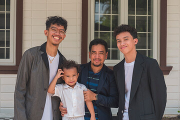 An asian with his 3 sons - The eldest in his early 20s, middle child in his teens, and the youngest...