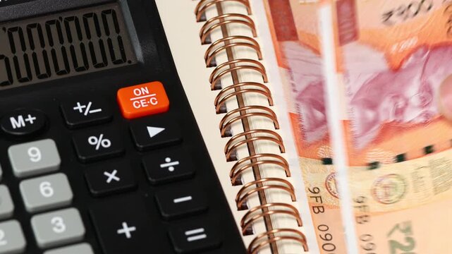India financial calculations. Accounting and business concept. Calculator and Indian Rupees deductible