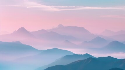 Fototapeta premium Misty mountain peaks rise into a pastel-colored sky at dawn, creating a serene and mystical landscape. The soft hues and foggy atmosphere evoke a sense of peace and wonder. 