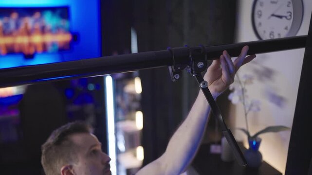 Mounting pole between walls on video production set 4K