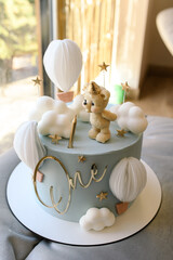 Charming First Birthday Cake with Bear and Balloon Toppers